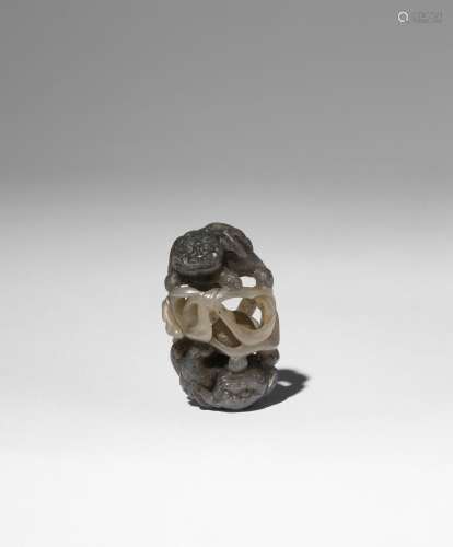 A SMALL CHINESE GREY AND CELADON OPENWORK JADE CARVING OF BU...