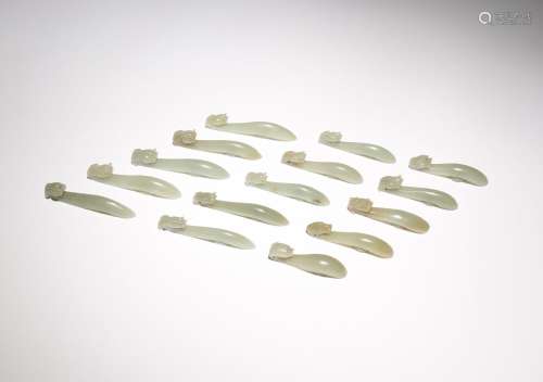 A GROUP OF FIFTEEN CHINESE CELADON JADE BELTHOOKS