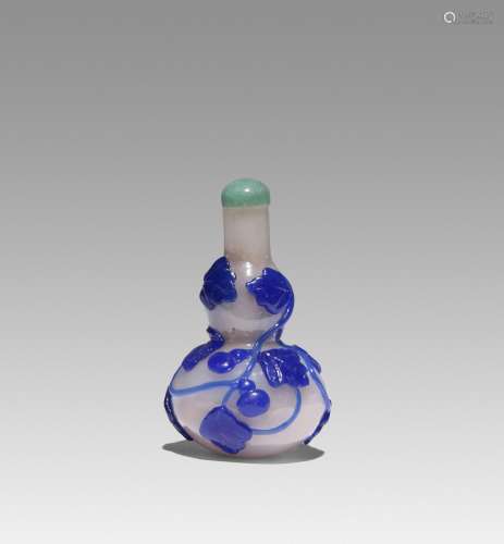 A CHINESE BLUE OVERLAY GLASS DOUBLE-GOURD SHAPED SNUFF BOTTL...