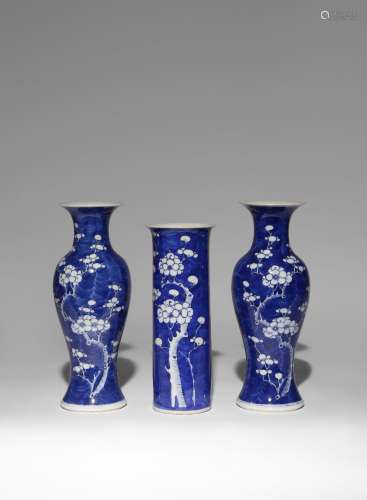 A GARNITURE OF THREE CHINESE BLUE AND WHITE 'PRUNUS' VASES