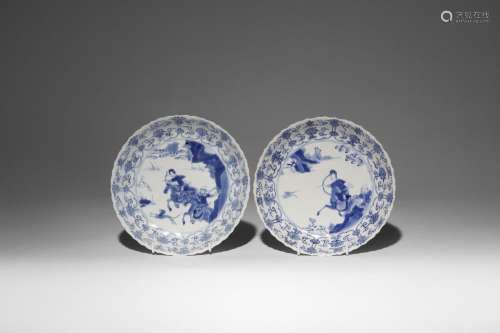 A PAIR OF CHINESE BLUE AND WHITE MOULDED 'HUNTING' DISHES