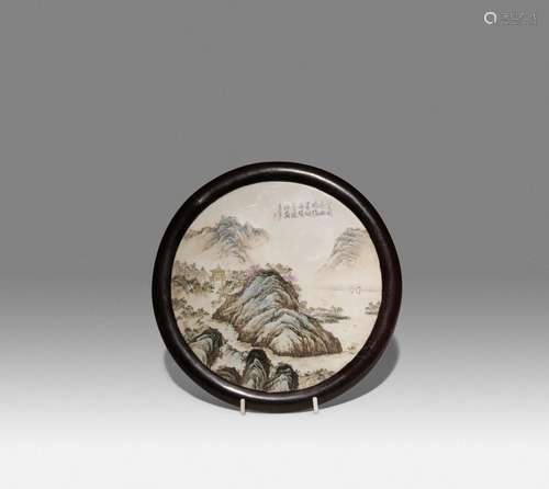 A CHINESE PORCELAIN FAMILLE ROSE CIRCULAR 'LANDSCAPE' PLAQUE