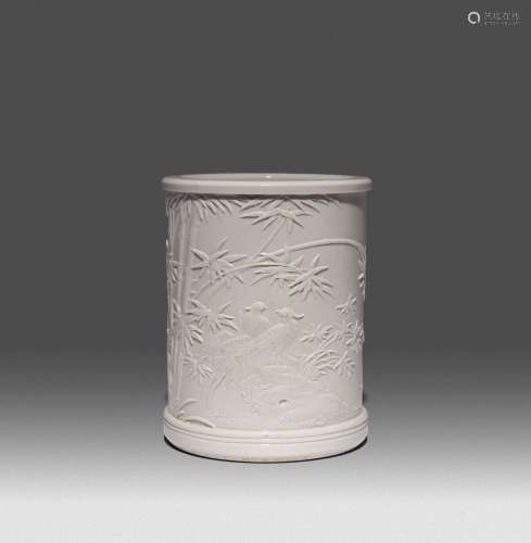 A CHINESE WHITE GLAZED MOULDED BRUSHPOT, BITONG