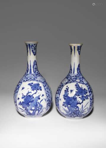 A PAIR OF CHINESE BLUE AND WHITE BOTTLE VASES