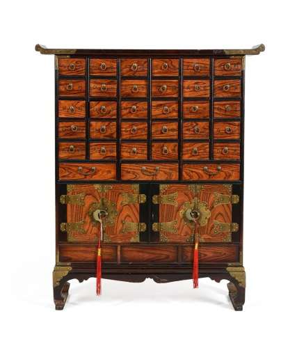 A Chinese wood medicine cabinet