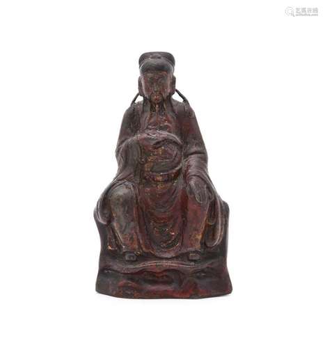 A Chinese lacquered bronze model of a seated scholar