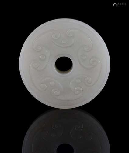 A Chinese celadon jade disc