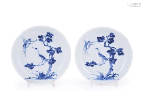 An unusual pair of Chinese blue and white saucers