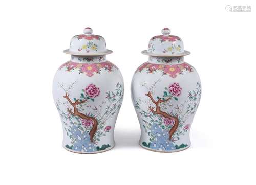 A large pair of Chinese Famille Rose vases and covers