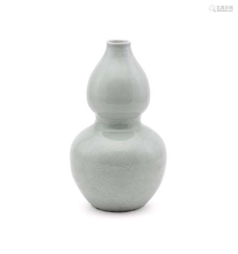 A Chinese celadon double gourd vase