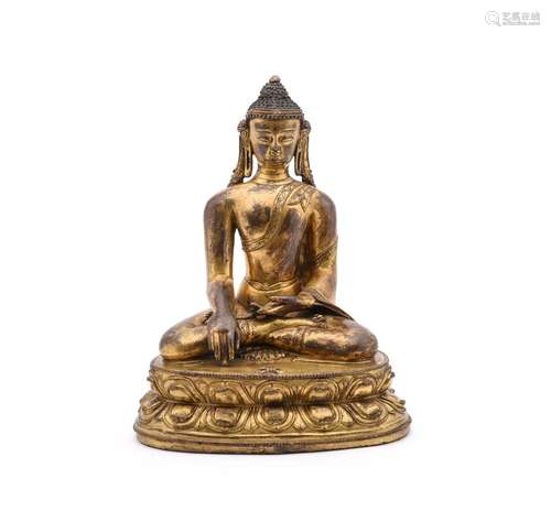 A Tibetan style gilt bronze figure of Buddha