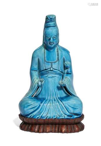 A Chinese porcelain monochrome blue-glazed figure of Guanyin