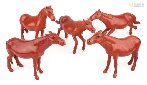 Five Chinese porcelain coral-glazed figures of horses