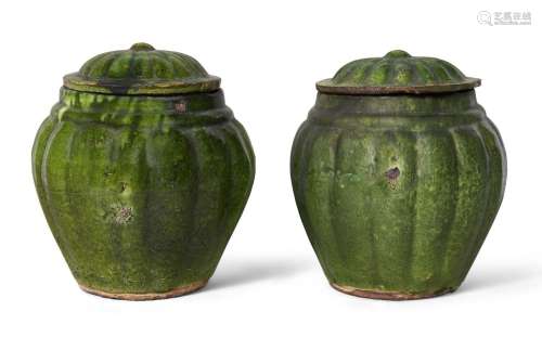 A pair of Chinese pottery green-glazed jars and covers