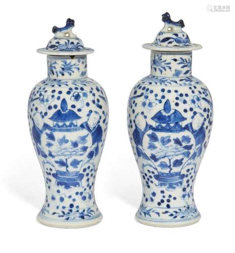 A pair of Chinese porcelain blue and white vases and covers