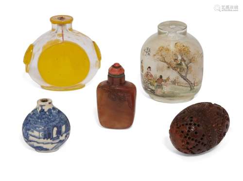 Four Chinese snuff bottles and a coquilla nut pomander
