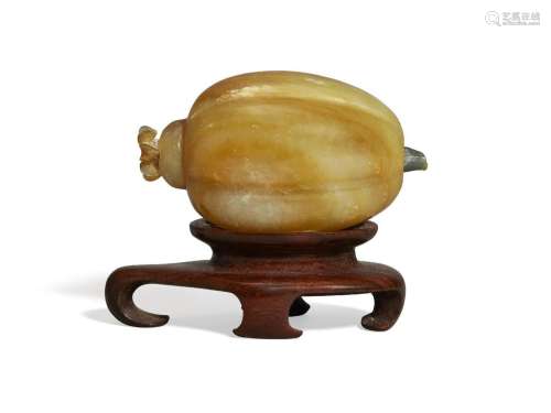 A Chinese celadon and russet hardstone 'melon' snuff bottle