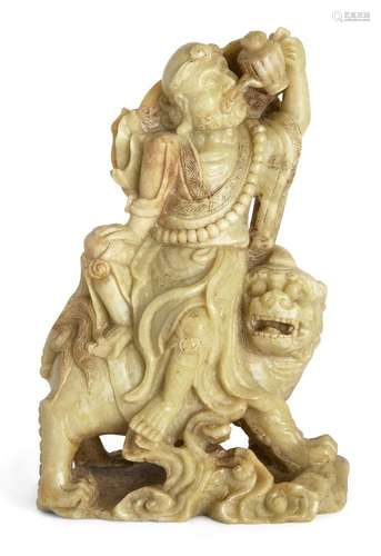 A Chinese carved soapstone figure of Li Tieguai on a qilin