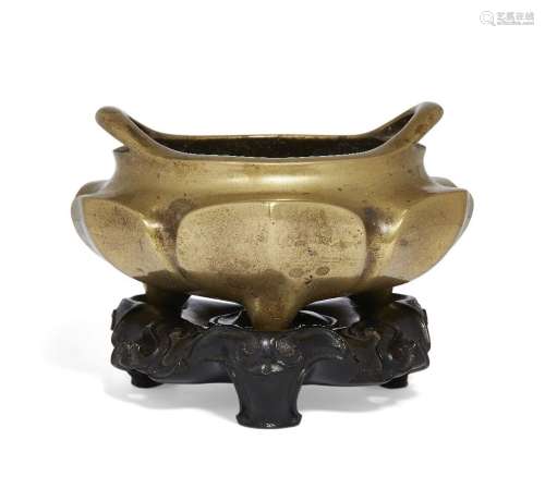 A Chinese polished bronze 'lotus' tripod censer