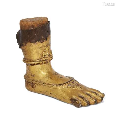 A Tibetan gilt bronze foot