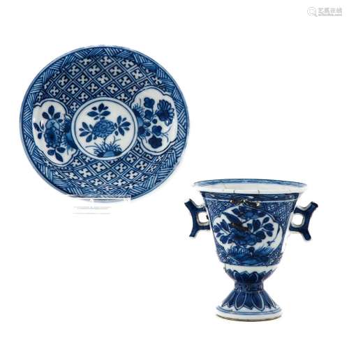 A Blue and White Stemmed Cup and Saucer