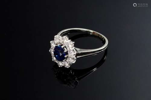 WG 750 Entourage ring with a sapphire (1.07ct) in a brillian...