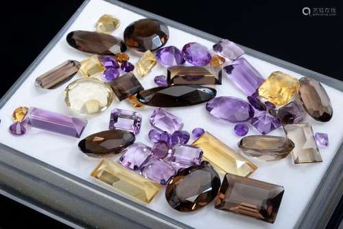 Lot of unmounted gemstones: Amethysts citrines and smoky qua...