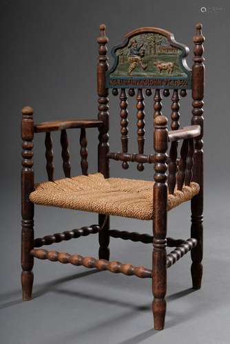 Old country children's armchair with turned frame wickerwork...