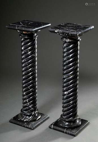 Pair of dark marble columns with turned shafts and angular b...