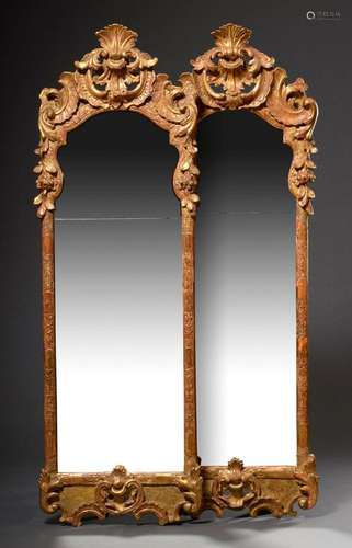 Pair of North German rococo mirrors with curved frames at th...