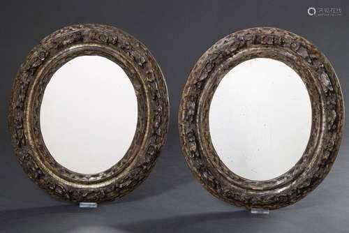 Pair of small oval mirrors in silver lustrated frames with f...