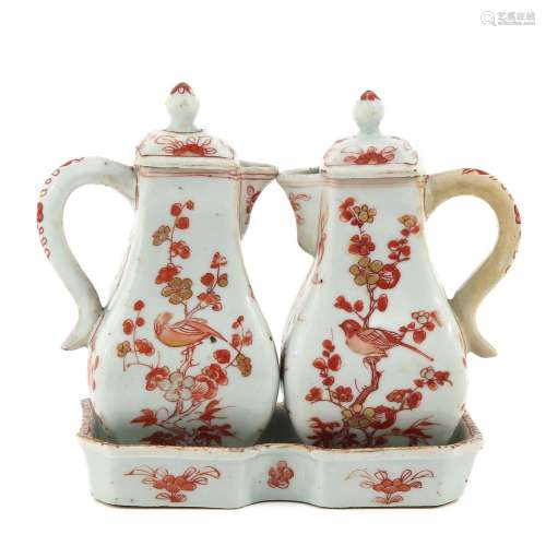 A Pair of Pitchers and Small Tray