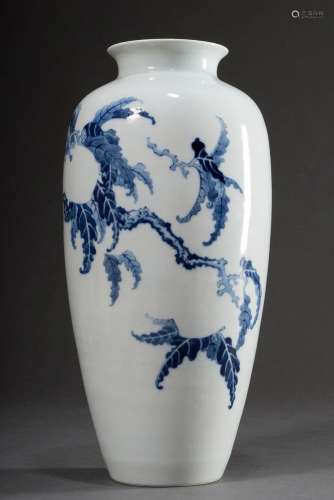 A slender Chinese porcelain vase with unfinished floral blue...