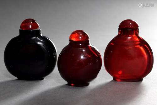 3 Various Peking glass snuffbottles in plain form ruby glass...