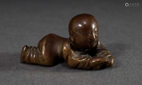 Small Chinese brass figure "Lying Child" dark pati...