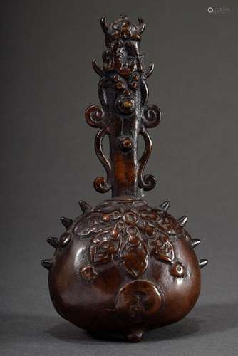 Chinese bronze clamp on three feet with figural handle and o...