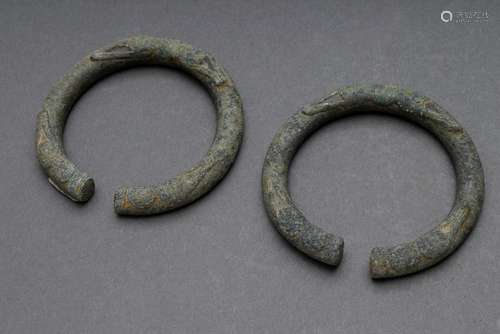 2 Various bronze bracelets with ornamental relief decoration...