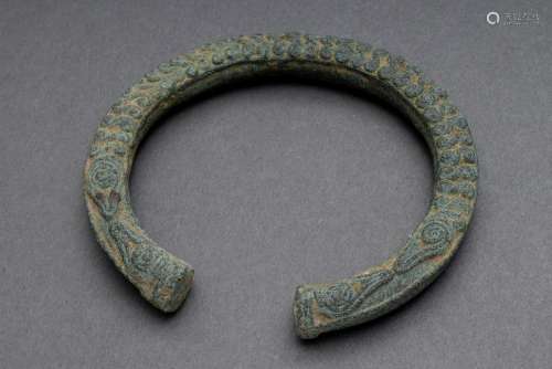 Large bronze bangle with ornamental relief decoration Cambod...