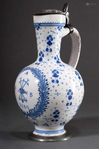 Faience narrow-necked jug with floral blue painting decorati...