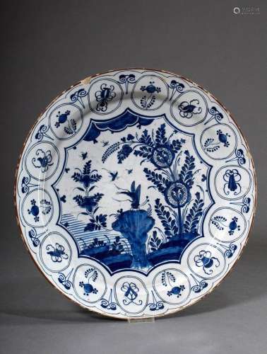 Large Delft faience plate with blue painting decoration afte...