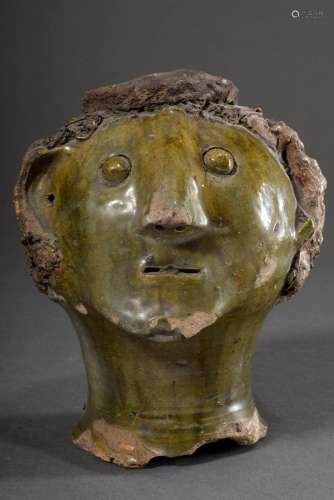 Fragment of a clay sculpture "Male head with curls and ...