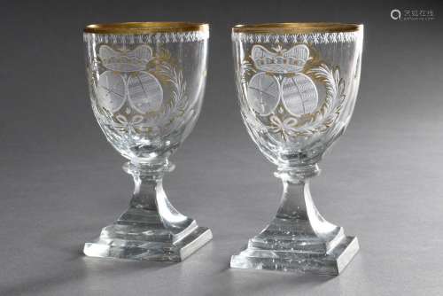 Pair of Empire glasses on angular base with cut coat of arms...