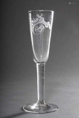Simple champagne glass with finely cut medallion and monogra...