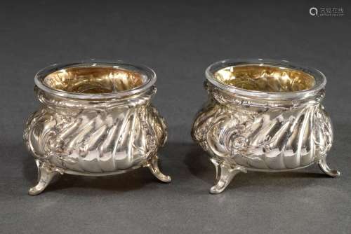 Pair of saliers in rococo façon on three feet with glass ins...