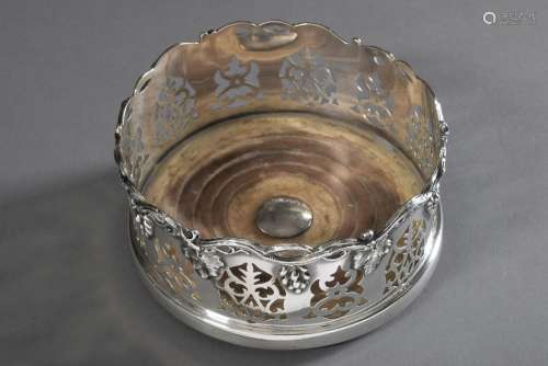 Bottle stand with openwork rim and "vine leaf" rel...