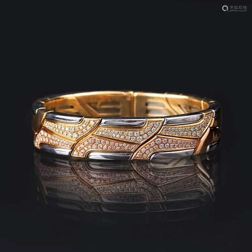 Bucherer. A Tricolour Bangle Bracelet with Diamonds 'Swan Ri...