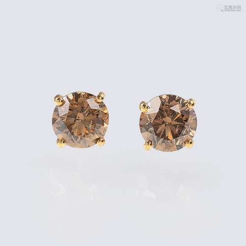 A Pair of Solitaire Diamond Earstuds with Fancy Diamonds.