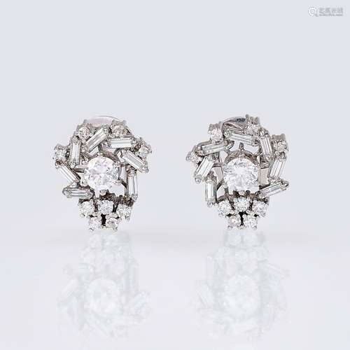 A Pair of Diamond Earrings.