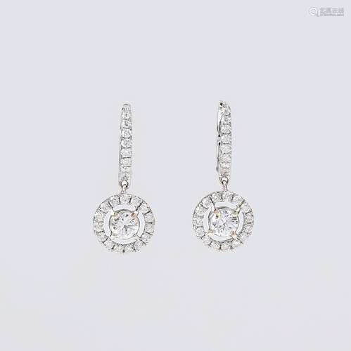 A Pair of Diamond Earrings.