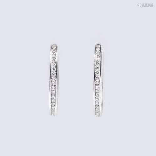 A Pair of Diamond Earrings.